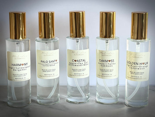 Clean water-based room and linen spray in glass bottle with gold cap