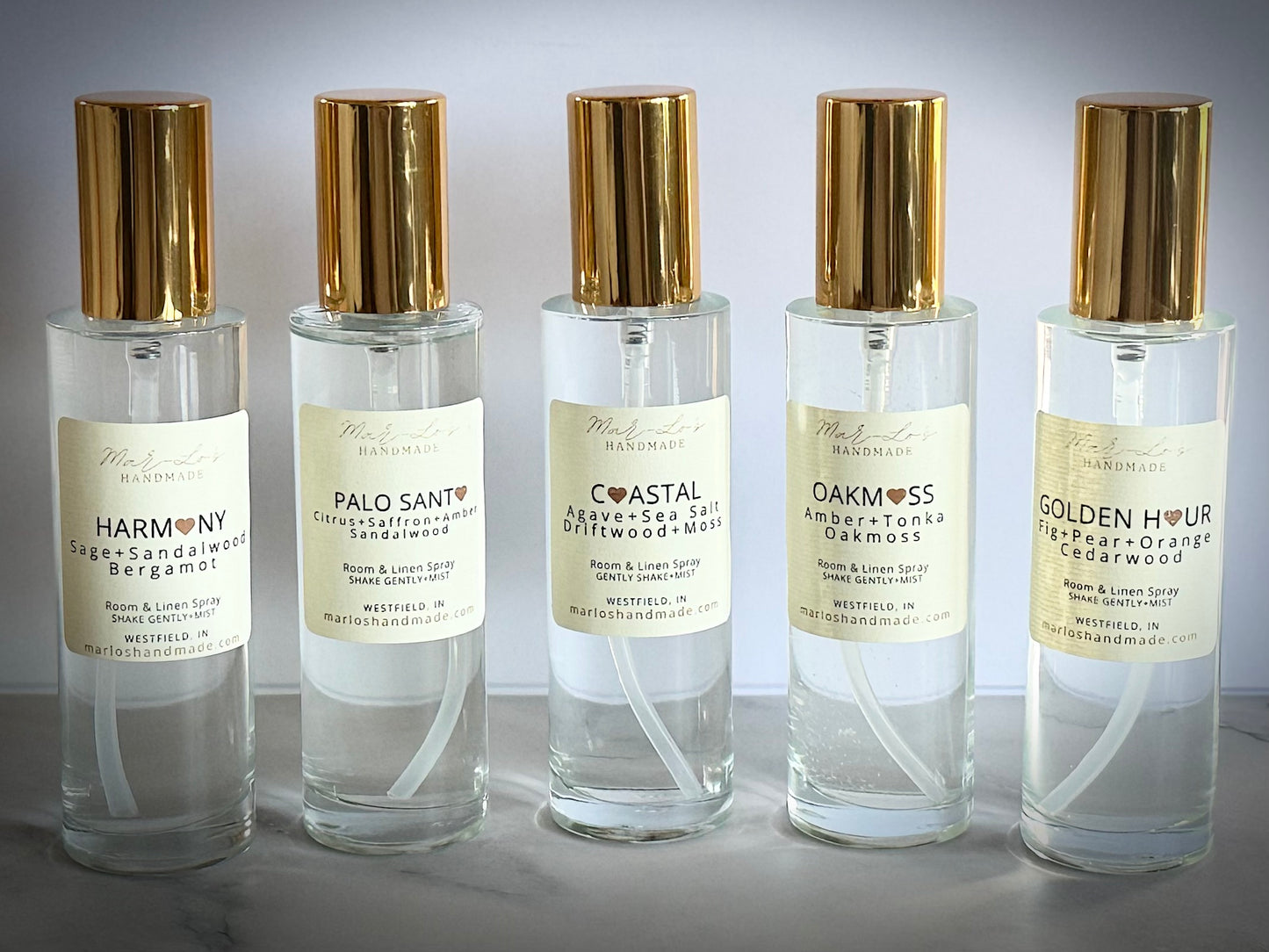 Clean water-based room and linen spray in glass bottle with gold cap