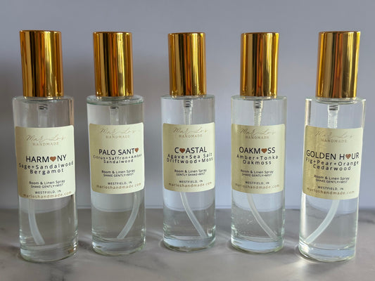 Clean water-based room and linen spray in glass bottle with gold cap